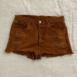 Levi’s cut off denim shorts in copper brown in size 28